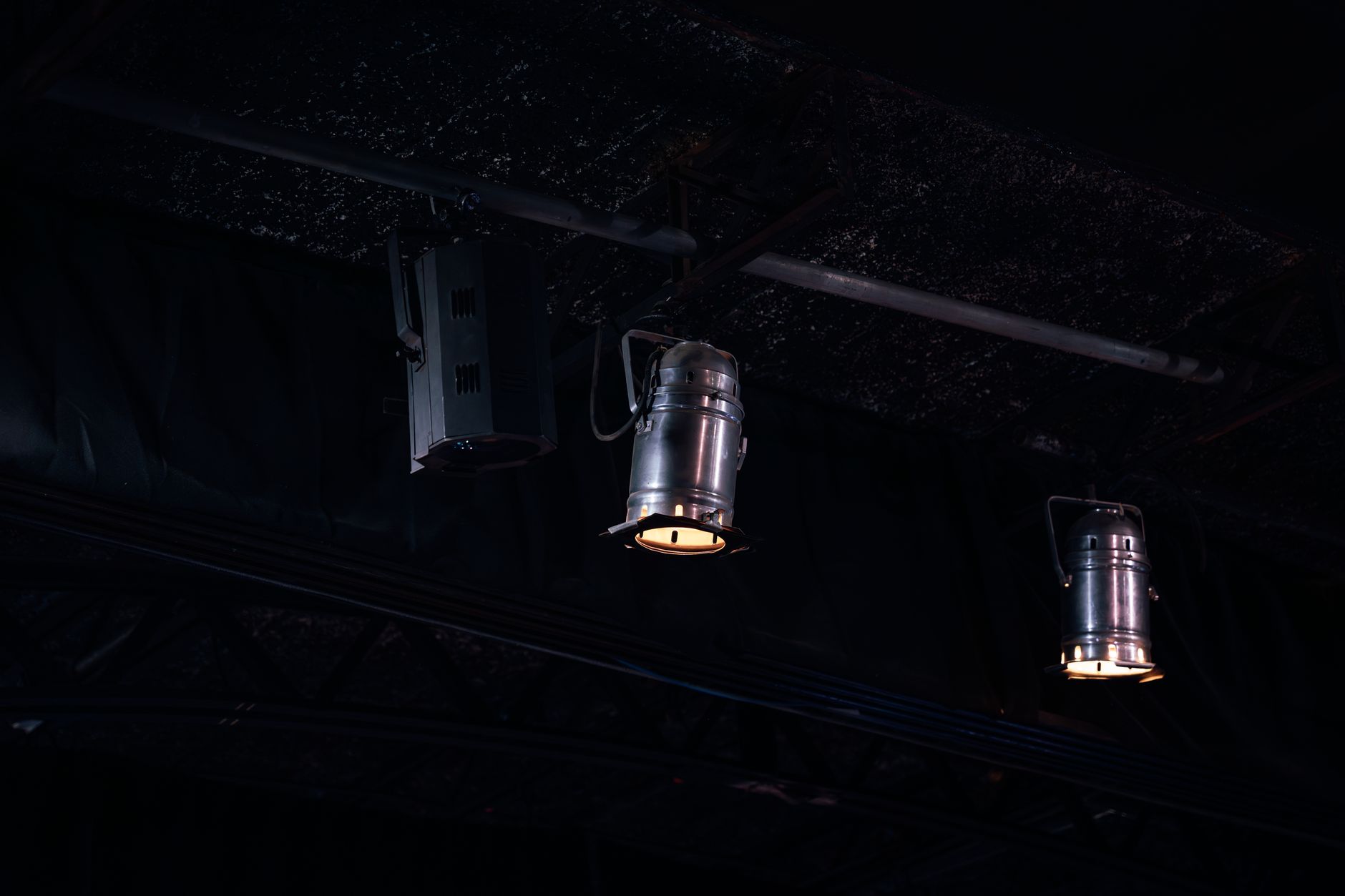 Dynamic theatrical and musical performance stage with complex neon lights and modern micro camera setups