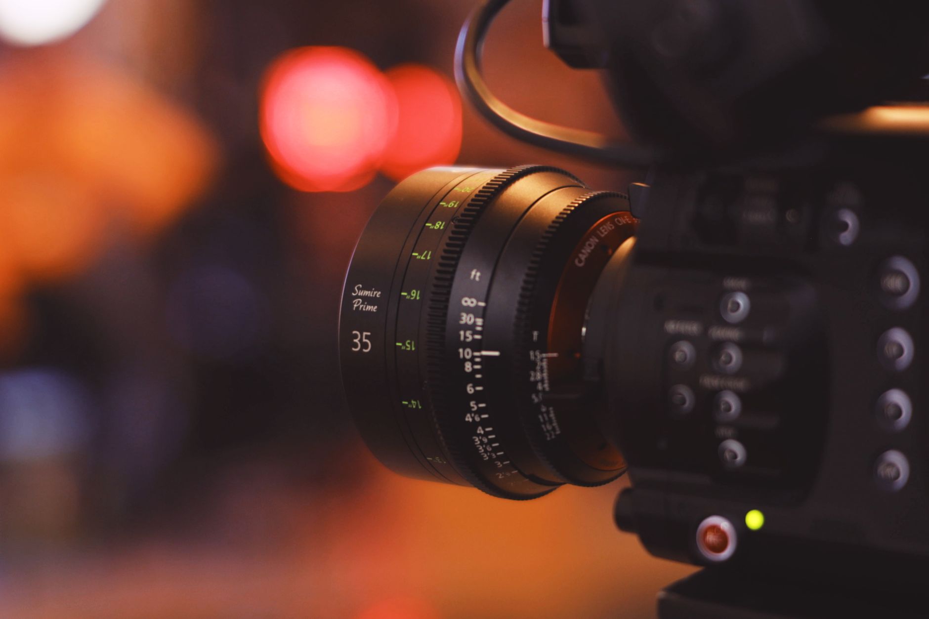 Close-up photo of modern professional cinema optical lens with accurate focus and aperture dials