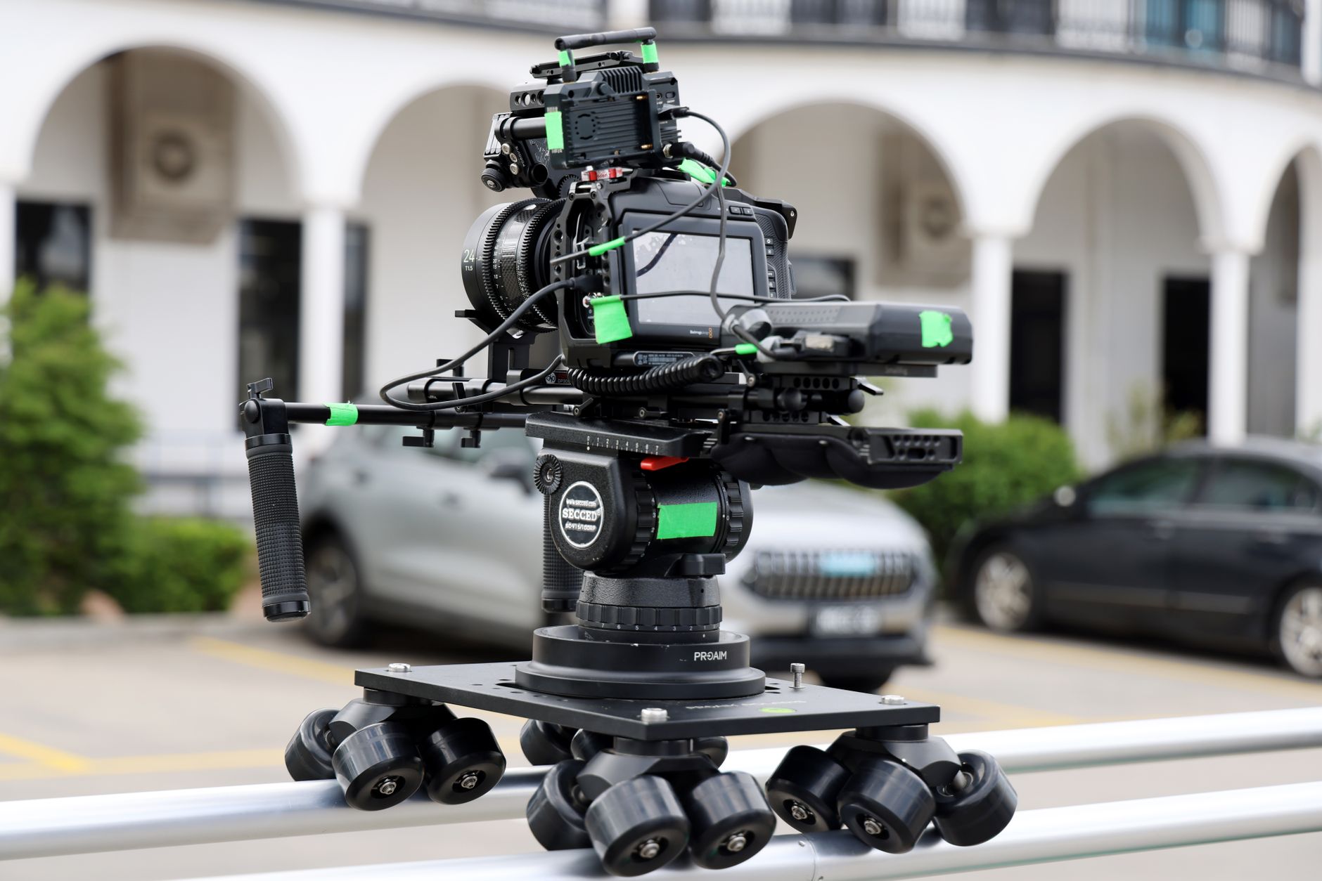 Lumina Stream live production camera set on a tracking rail dolly inside a cinematic studio room